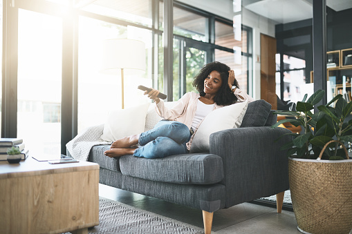 Shot of an attractive young woman relaxing at home