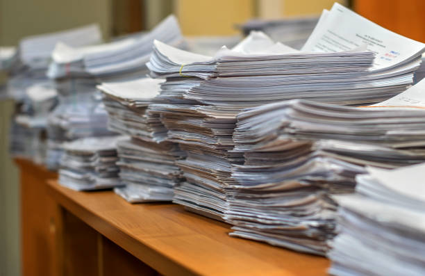 istock pile of paper documents in the office 1136986596