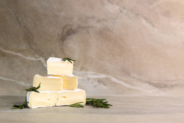 istock Cheese camembert or brie with fresh rosemary 1136988657
