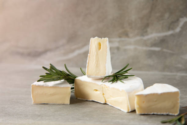 istock Cheese camembert or brie with fresh rosemary 1136988710
