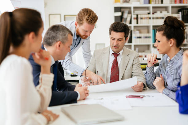 istock Group of business people working as team in office 1136990779