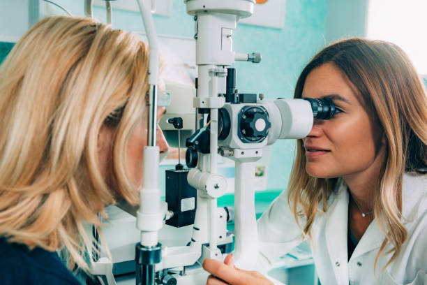 istock Optometrist Examining Patient At Clinic 1136991645