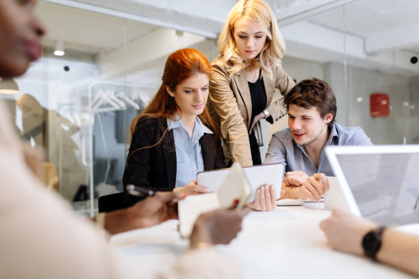 istock Business people collaborating in office and working on project together 1136992943