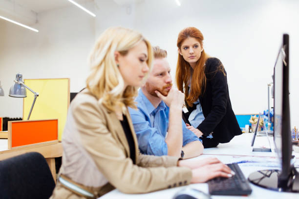 istock Businesspeople working in office 1136992989