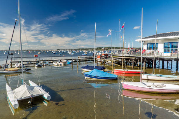 Poole Harbour Dorset England Poole Harbour from Sandbanks Dorset England UK Europe poole harbour stock pictures, royalty-free photos & images