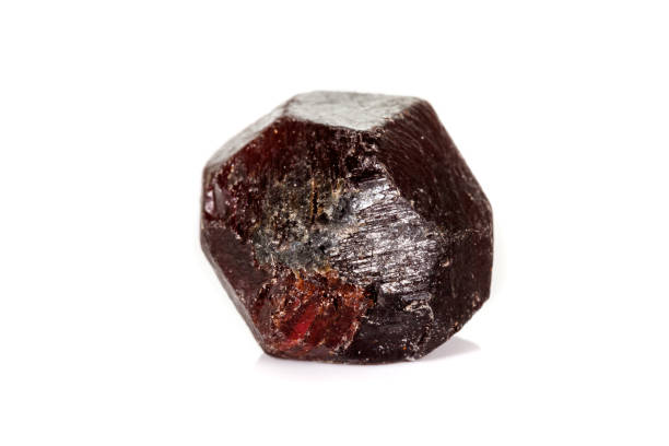 istock macro mineral stone  Garnet, on a white background 1136999512