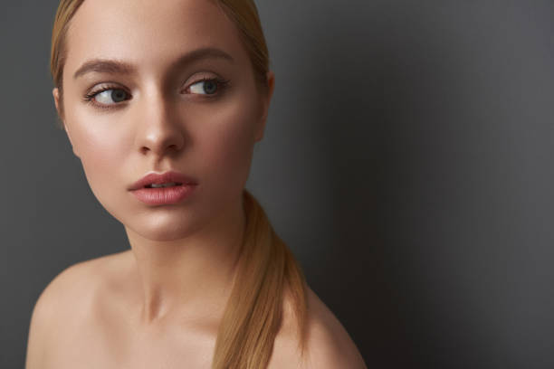 istock Long haired woman thoughtfully looking into the distance 1137004778