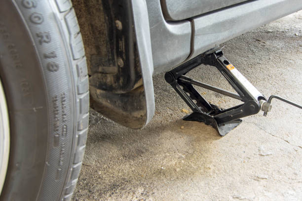 istock car jack up for wheel changing or repairing 1137005059