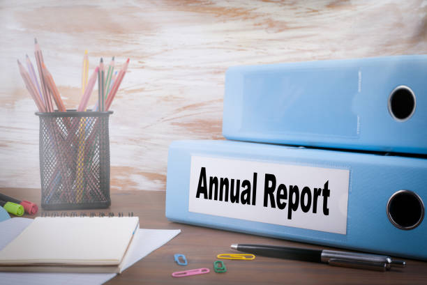 istock Annual Report, Office Binder on Wooden Desk 1137005097