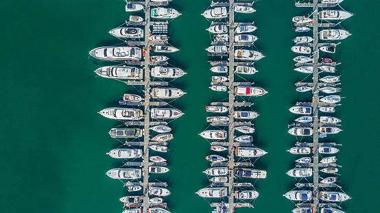 Yacht parking, A marina lot, Yacht and sailboat is moored at the quay, Aerial view by drone.