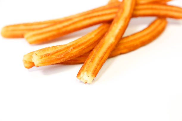 istock spanish fritters with white background 1137008623