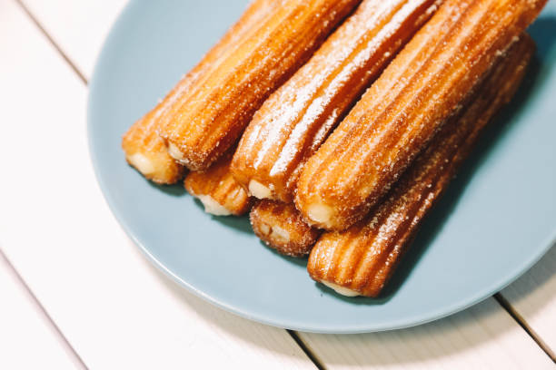 istock spanish sugar fritters served on blue dish on a wooden table 1137009319