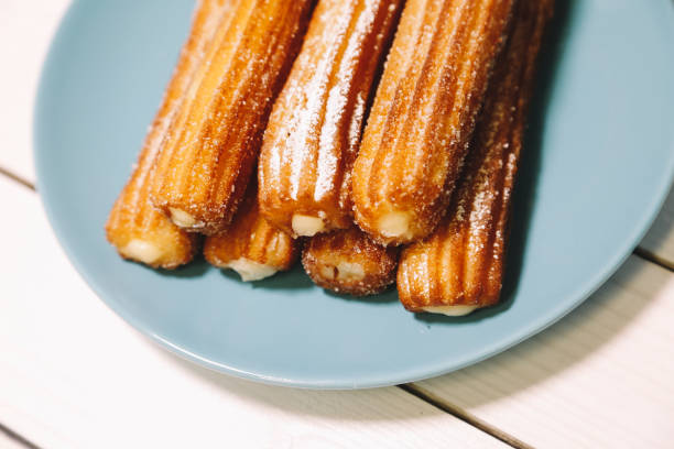 istock spanish sugar fritters served on blue dish on a wooden table 1137009330