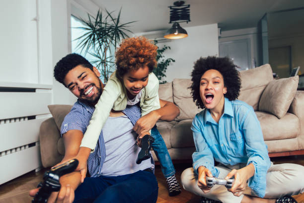 istock Family Playing Video Games Together 1137010812