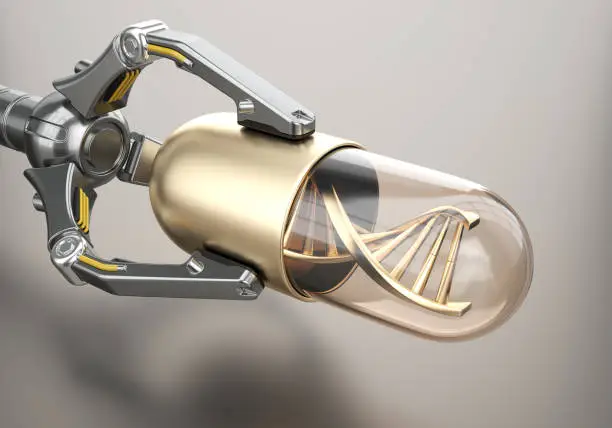 Photo of Robotic arm holds golden pill with DNA