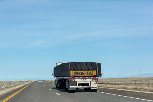 Truck with oversize load driving at interstate highway of nevada utah USA America