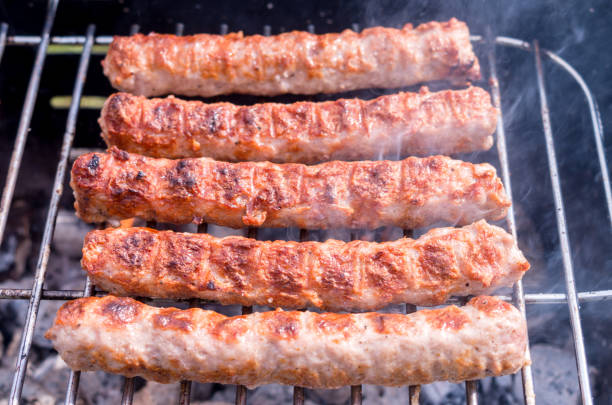 istock Grilling. Cooking barbecue with charcoal in the garden. T 1137011921