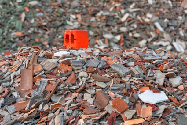 Broken Roof Tile from Hurricane Irma at the landfill marked by a red concrete block stock photo