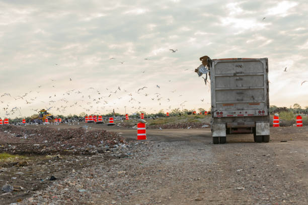 Commercial dump truck taking trash to the landfill stock photo
