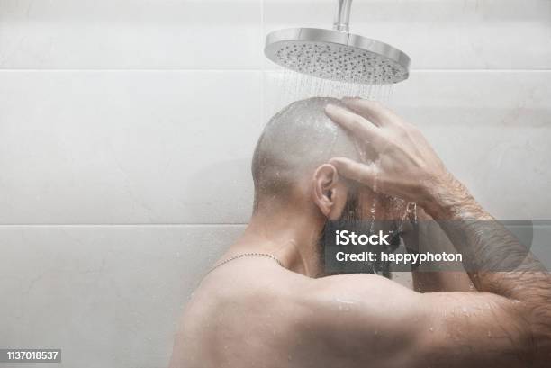 A Man Washes In The Shower Side View Stock Photo - Download Image Now - Shower, Heat - Temperature, Men