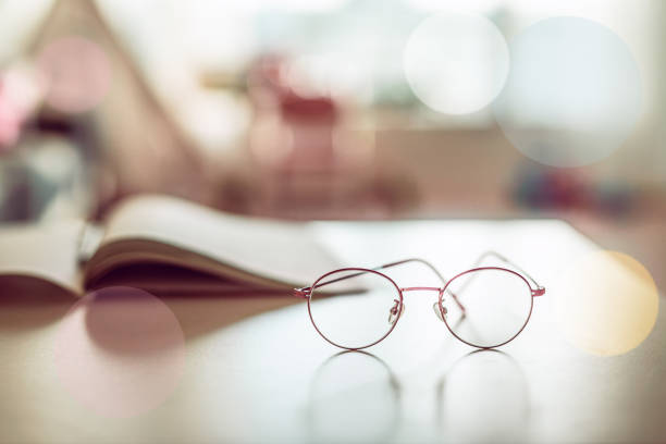 glasses on desk in house with selective focus.