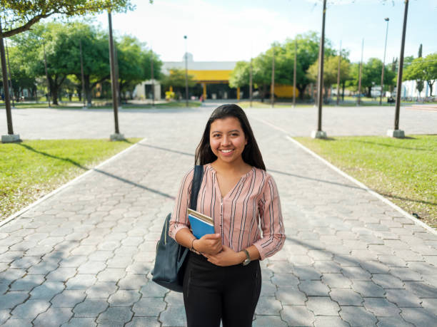 Smiling young latin student stock photo