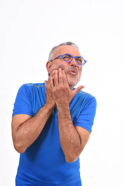 istock man with pain on nose on white background 1137020234