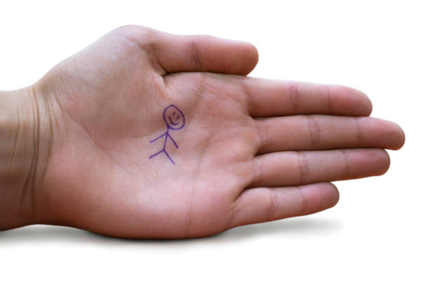 istock Childs hand with a secret symbol 1137020279