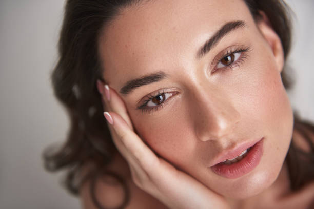 istock Close up portrait sensual brunette female on white 1137021814