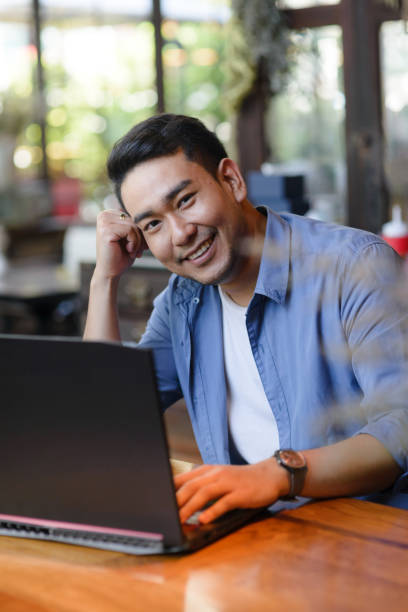 istock Asian man working with laptop in cafe, work concept. 1137021907