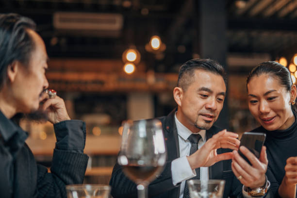 istock Business people sitting in restaurant 1137022999