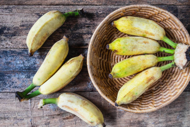 istock Organic banana in basket on wooden table 1137024976