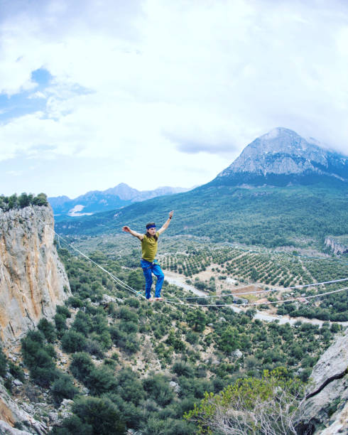 istock Man balancing on the rope concept of risk taking and challenge. 1137026498