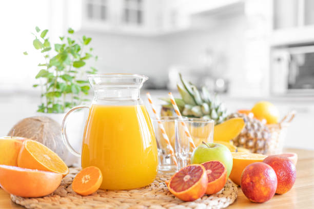 istock Multifruit juice and fresh fruit on table on kitchen background closeup 1137026516