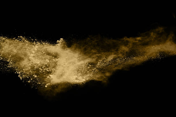 istock Golden powder explosion on black background. Freeze motion. 1137026931