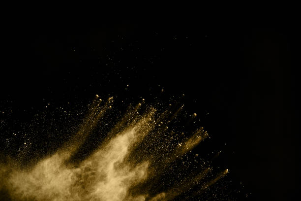 istock Golden powder explosion on black background. Freeze motion. 1137026948