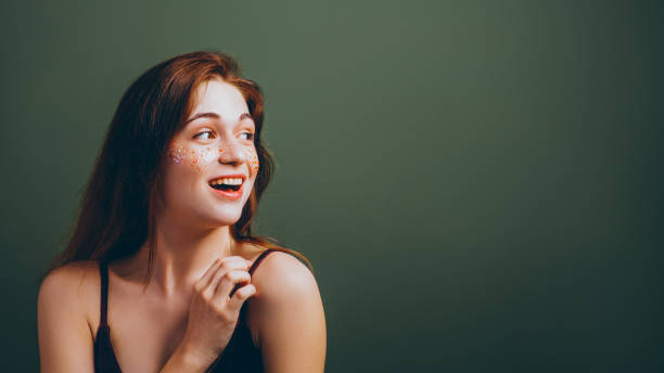 istock wow girl smiling young woman looking sideways 1137027014