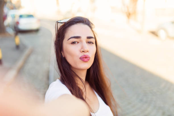 istock Pretty woman taking a selfie 1137027038