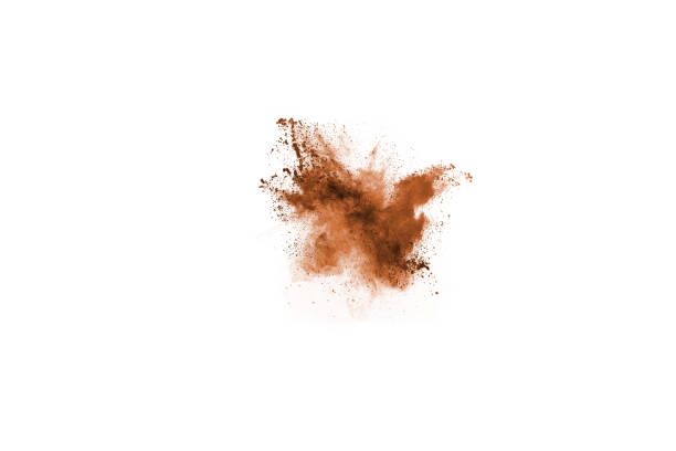 istock Brown color powder explosion on white background. Colored cloud. Colorful dust explode. Paint Holi. 1137027062