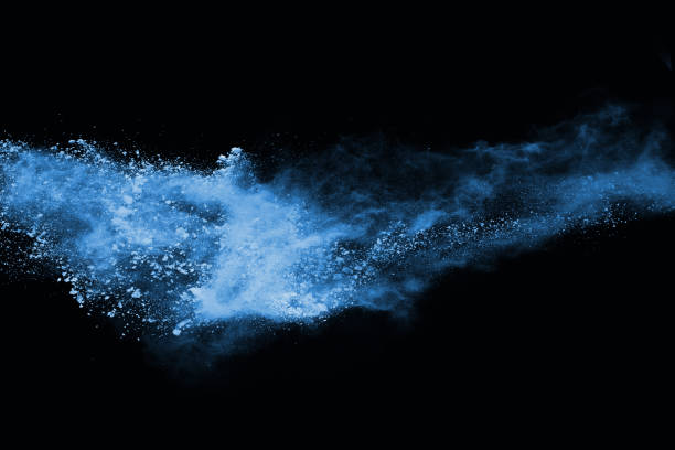 istock abstract blue powder splatted background,Freeze motion of color powder exploding/throwing color powder,color glitter texture on black background 1137027120