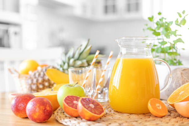 istock Multifruit juice and fresh fruit on table on kitchen background closeup 1137027230