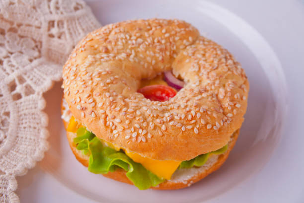 istock Fresh healthy bagel sandwich on a white plate 1137028359
