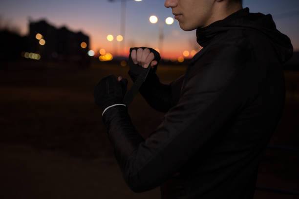 istock Male sportsman is preparing to start evening training 1137029199