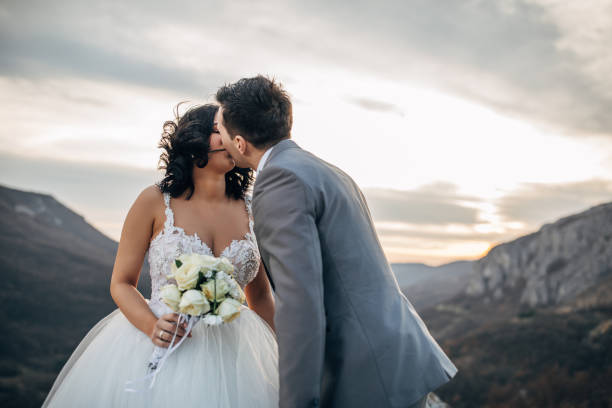 istock Married couple kissing in nature 1137029723
