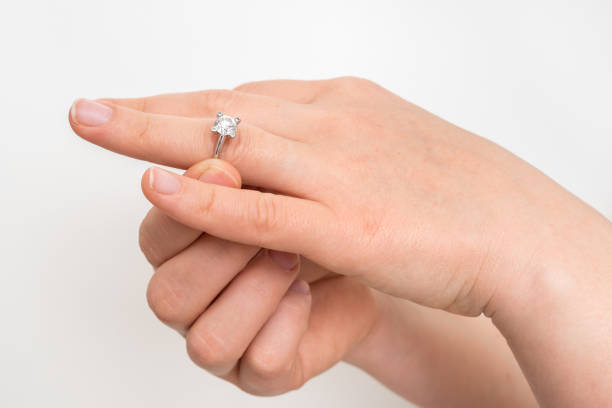 istock Woman take off wedding ring 1137029742