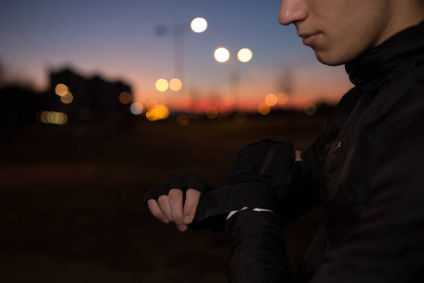 istock Male sportsman is preparing to start evening training 1137029851