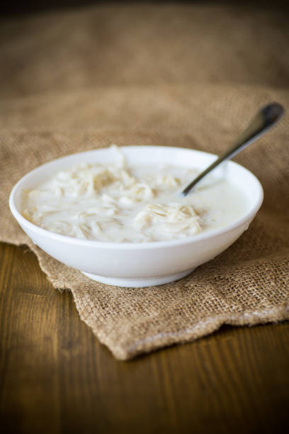 homemade sweet noodles with milk in a plate stock photo