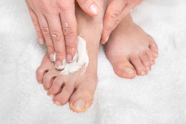 istock Woman applying moisturizer cream on her feet 1137030131