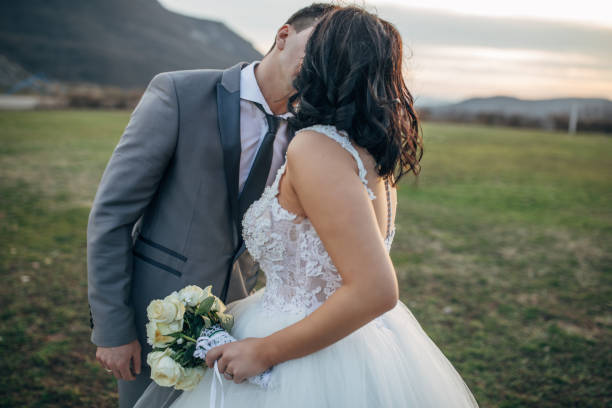 istock Married couple kissing in nature 1137030229