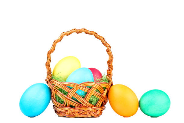 istock Easter eggs in basket isolated on white background 1137031828